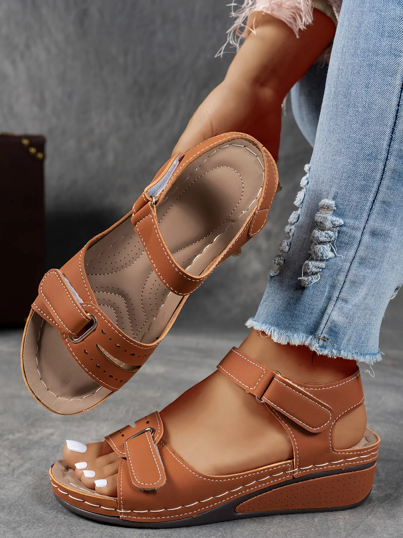 Ladies' beige wedge heel sandals with adjustable ankle straps, breathable perforated design, casual summer fashion