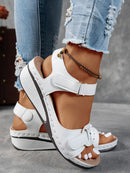 Ladies' beige wedge heel sandals with adjustable ankle straps, breathable perforated design, casual summer fashion