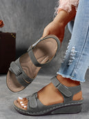 Ladies' beige wedge heel sandals with adjustable ankle straps, breathable perforated design, casual summer fashion