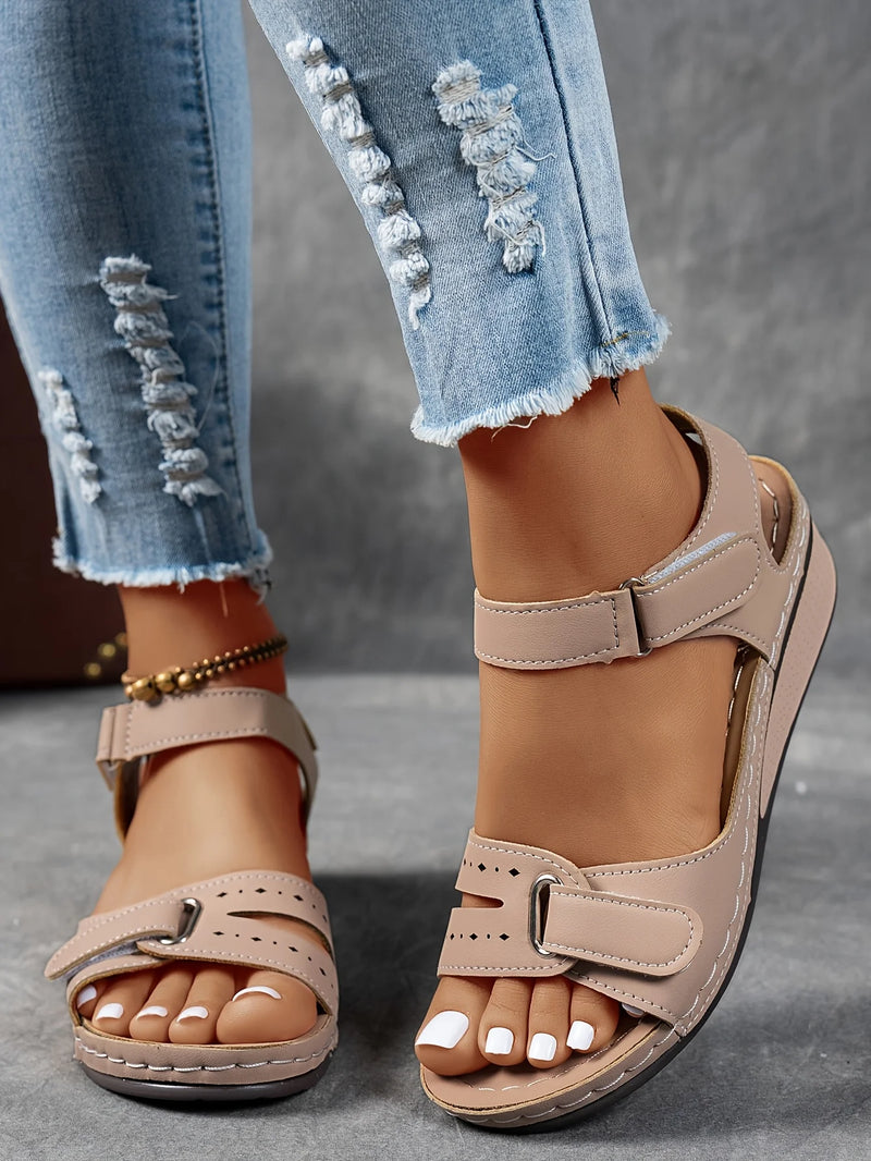 Ladies' beige wedge heel sandals with adjustable ankle straps, breathable perforated design, casual summer fashion