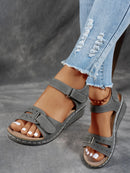 Ladies' beige wedge heel sandals with adjustable ankle straps, breathable perforated design, casual summer fashion