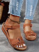 Ladies' beige wedge heel sandals with adjustable ankle straps, breathable perforated design, casual summer fashion