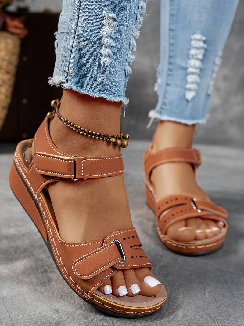 Ladies' beige wedge heel sandals with adjustable ankle straps, breathable perforated design, casual summer fashion