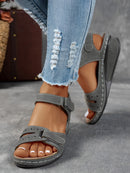 Ladies' beige wedge heel sandals with adjustable ankle straps, breathable perforated design, casual summer fashion