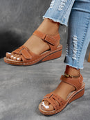 Ladies' beige wedge heel sandals with adjustable ankle straps, breathable perforated design, casual summer fashion