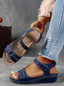 Ladies' beige wedge heel sandals with adjustable ankle straps, breathable perforated design, casual summer fashion