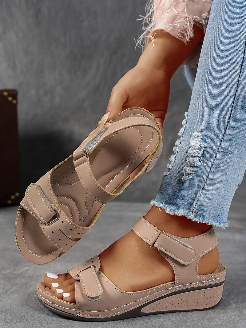 Ladies' beige wedge heel sandals with adjustable ankle straps, breathable perforated design, casual summer fashion